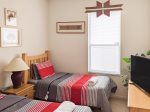 Twin Bedroom with Flatscreen TV and Custom Native American Cornices